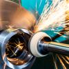 Metal polishing machine with sparks flying.