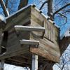 Tree house in a winter forest.