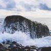 Ocean waves craching against a rock